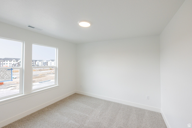 4741 Olive Avenue, Unit 406 Mapleton, UT 84664 - Photo 17 of 20 Empty room with baseboards and light carpet