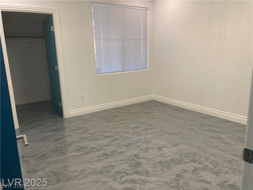 9050 West Warm Springs Road, Unit 1027 Las Vegas, NV 89148 - Photo 18 of 44 Well-appointed bedroom with hard surface flooring and a convenient closet.