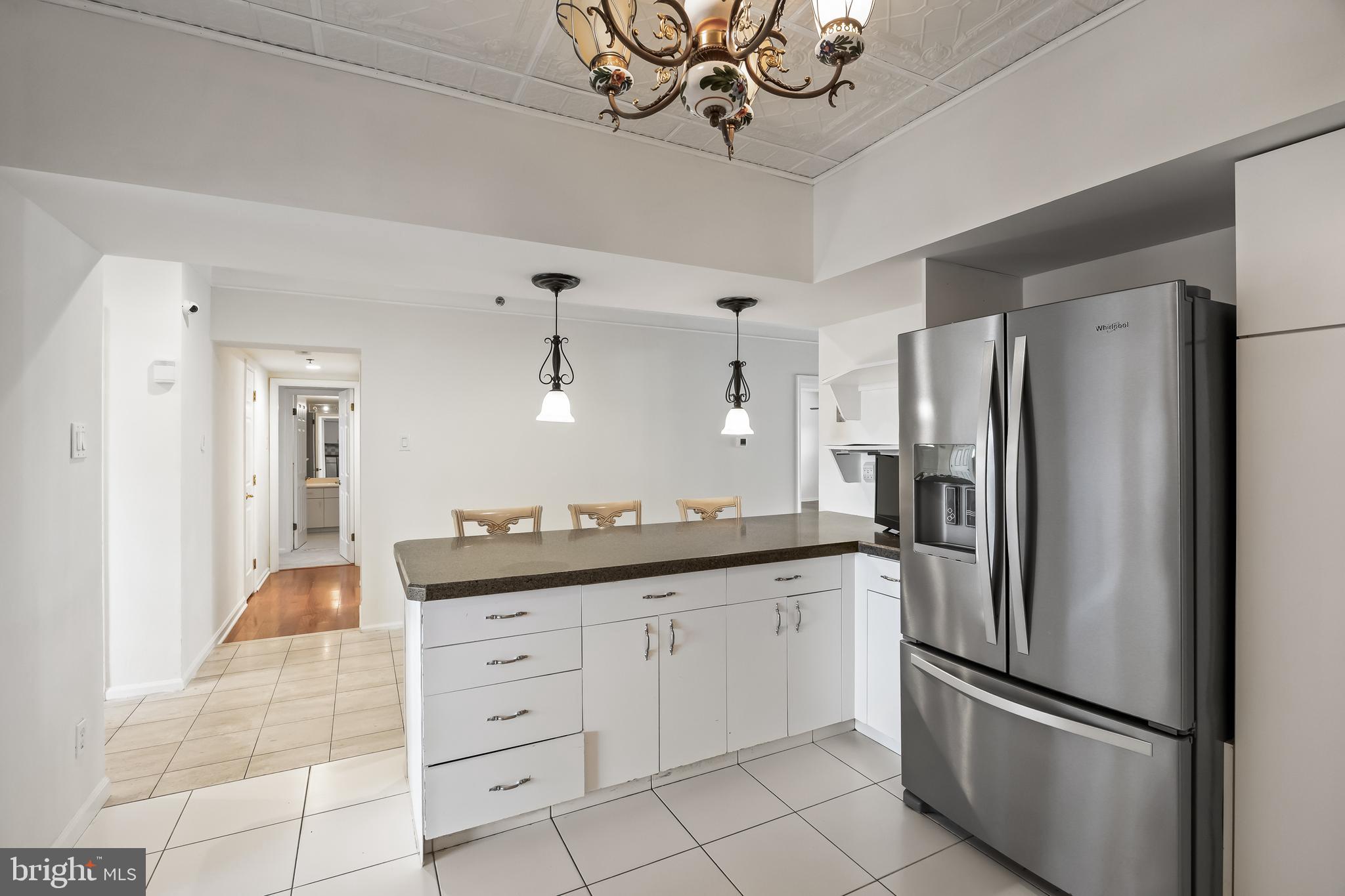 6072 Main Street Voorhees, NJ 08043 - Photo 11 of 41 a kitchen with stainless steel appliances a refrigerator sink and cabinets