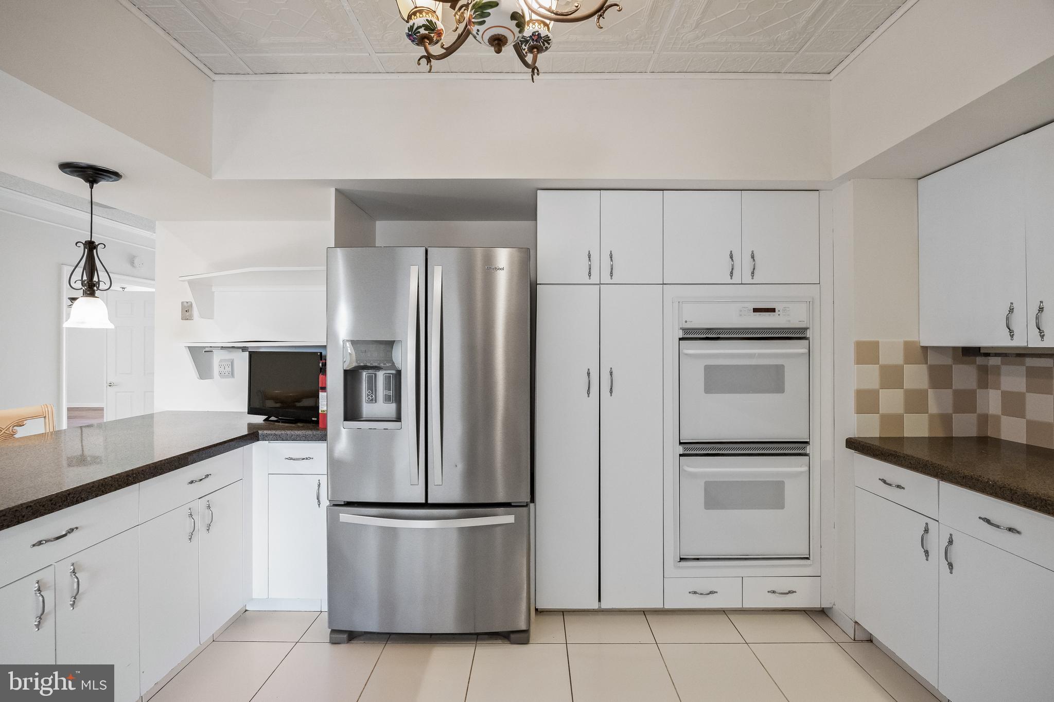 6072 Main Street Voorhees, NJ 08043 - Photo 13 of 41 a kitchen with white cabinets and white appliances