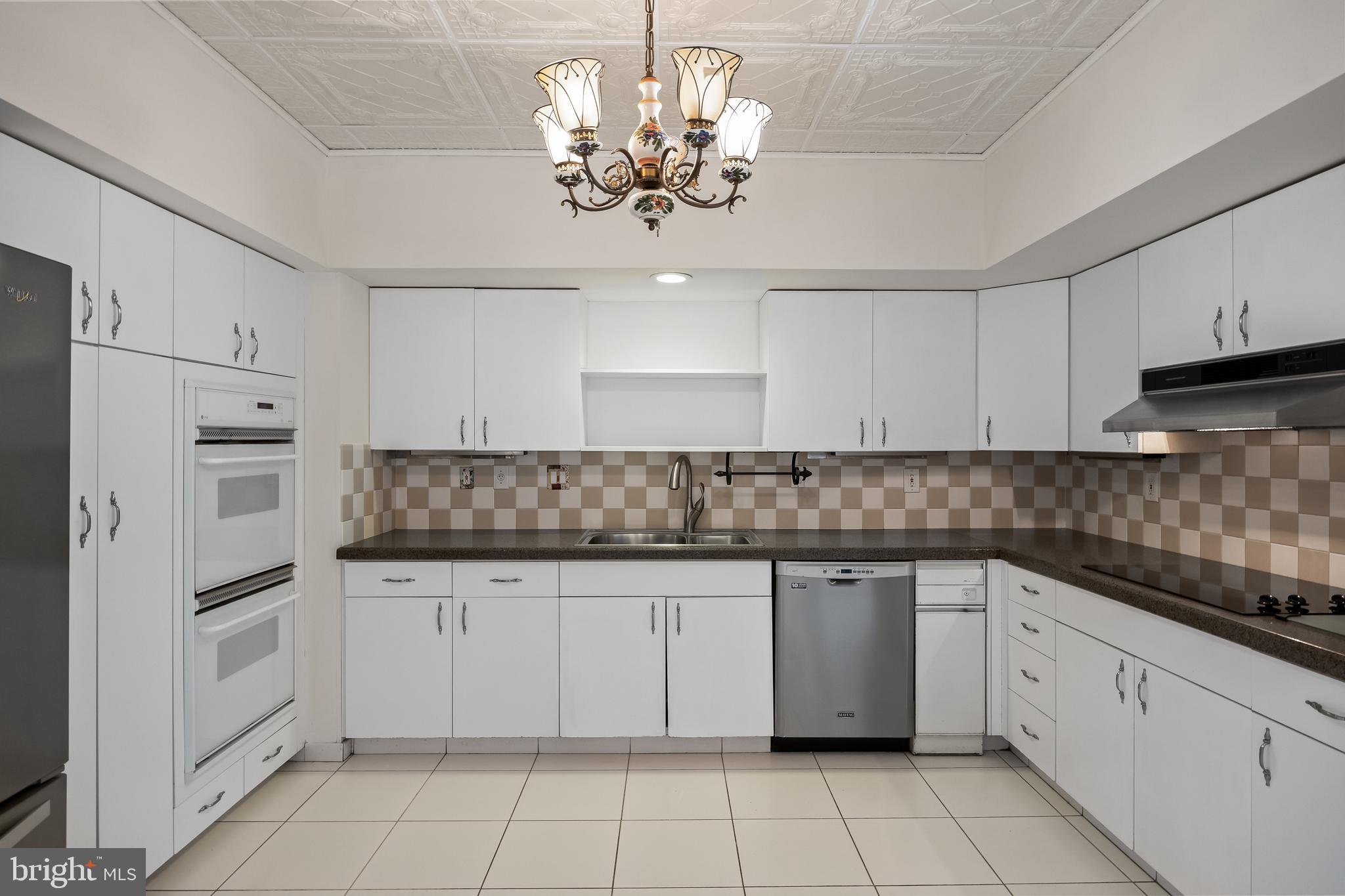 6072 Main Street Voorhees, NJ 08043 - Photo 14 of 41 a kitchen with white cabinets appliances and a sink