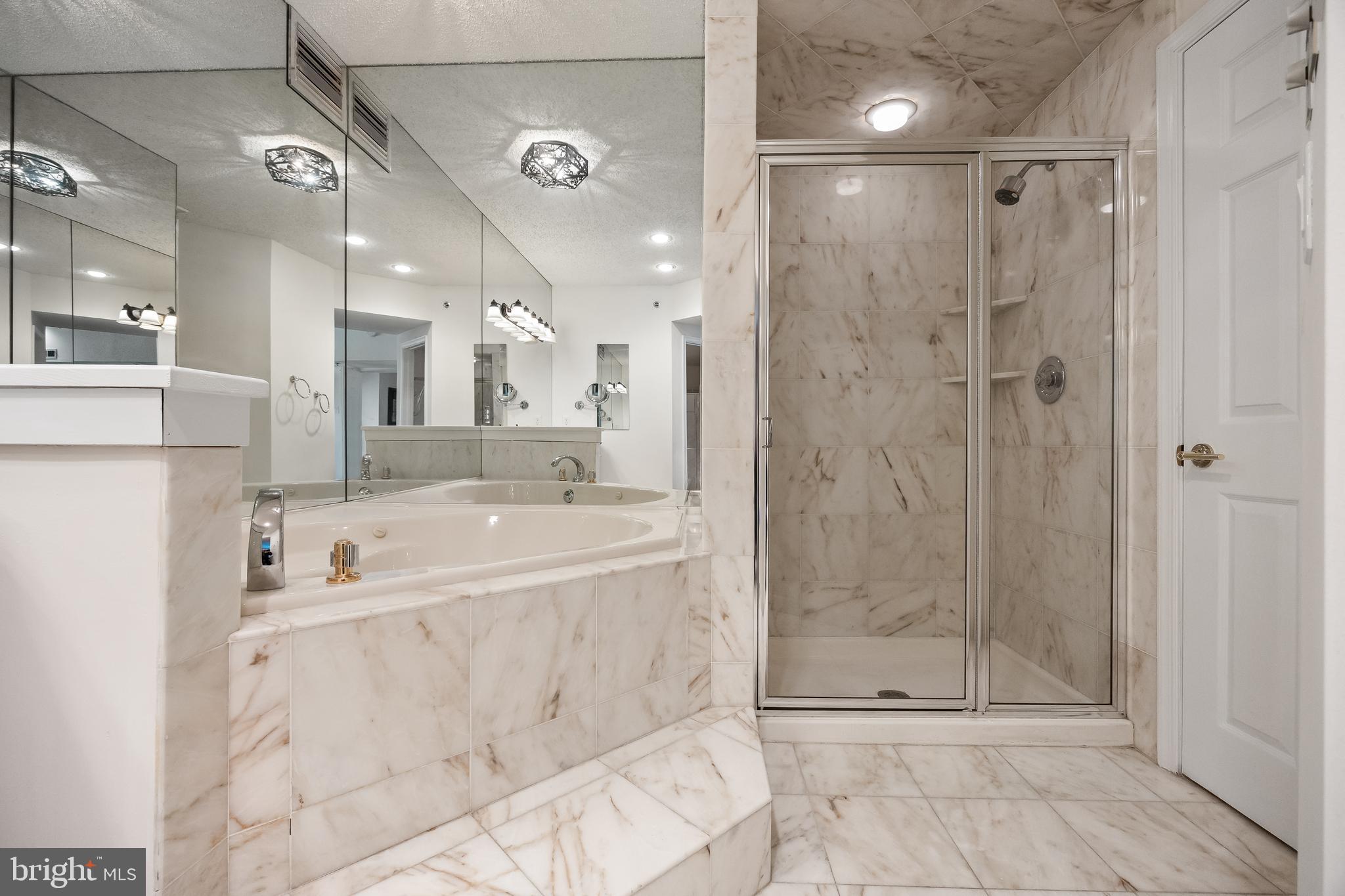 6072 Main Street Voorhees, NJ 08043 - Photo 16 of 41 a spacious bathroom with a bathtub and shower