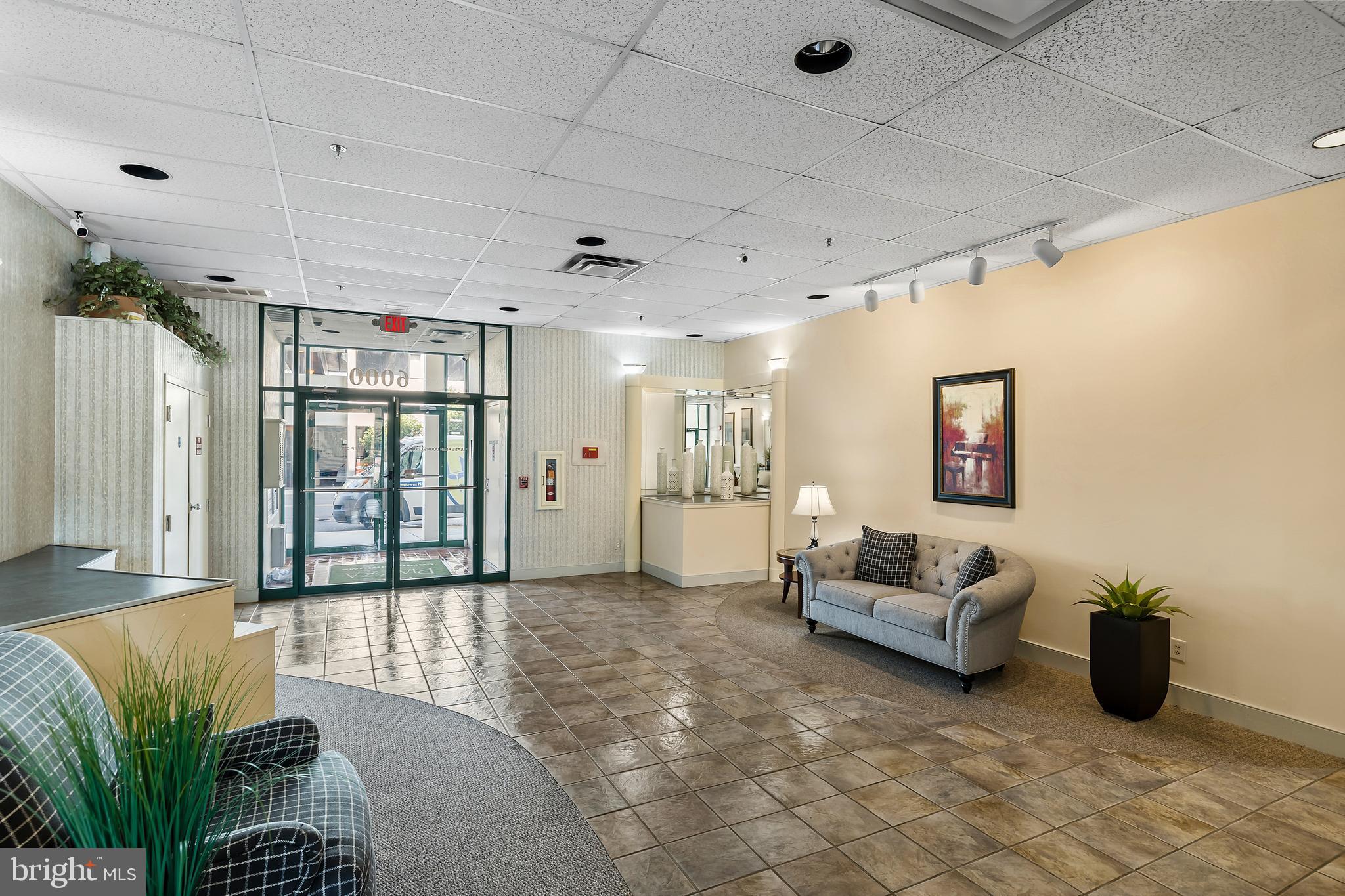 6072 Main Street Voorhees, NJ 08043 - Photo 23 of 41 a living room with furniture and a rug