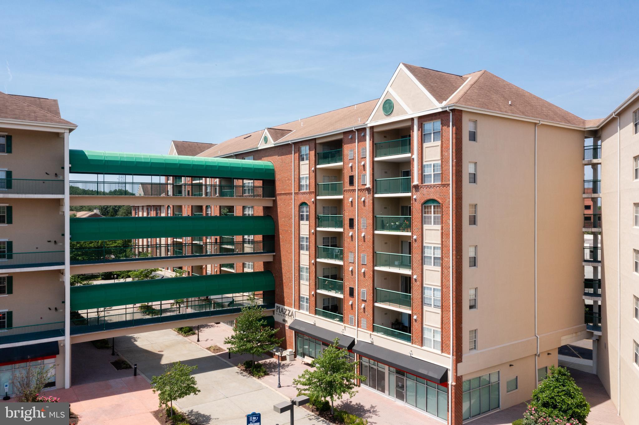 6072 Main Street Voorhees, NJ 08043 - Photo 26 of 41 a front view of a building with glass windows and brick walls