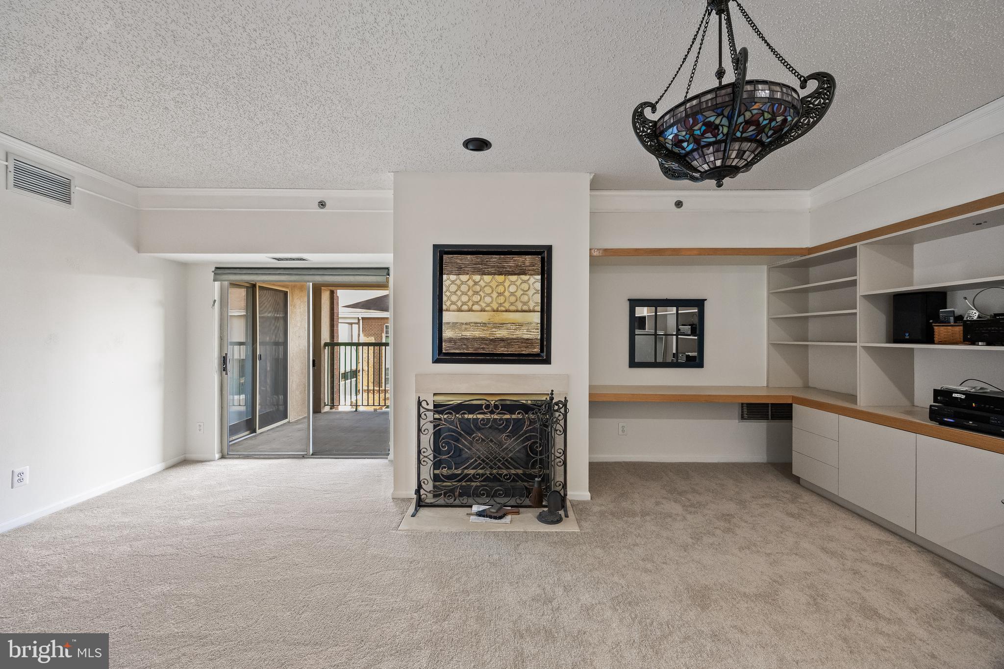 6072 Main Street Voorhees, NJ 08043 - Photo 6 of 41 a view of a livingroom with a fireplace a sink and dishwasher cabinets