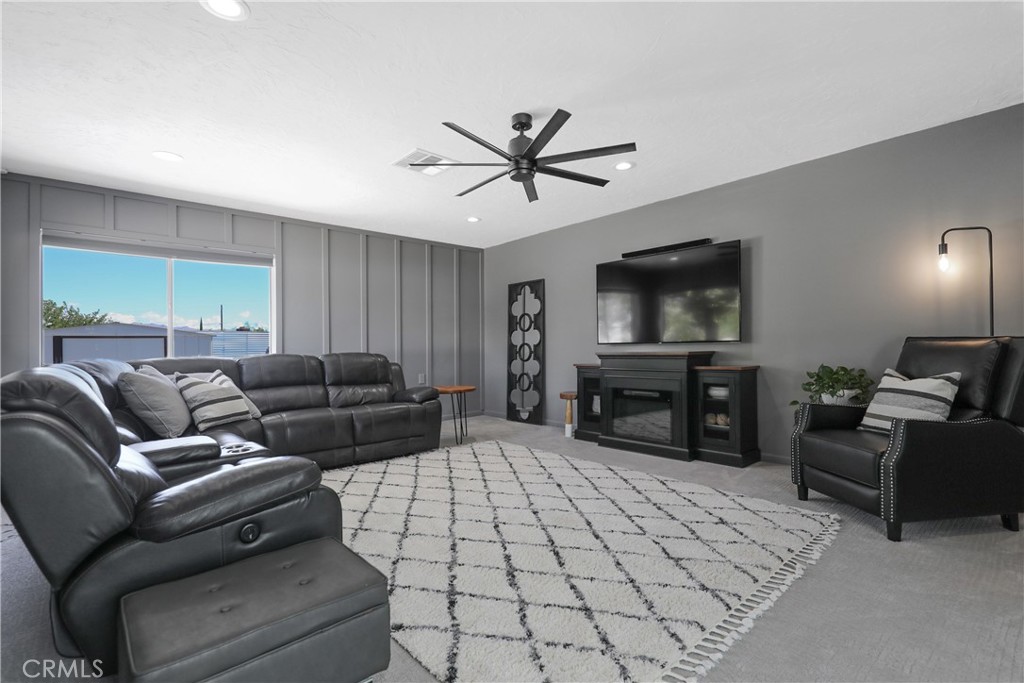 56800 Java Drive Yucca Valley, CA 92284 - Photo 15 of 43 a living room with furniture and a flat screen tv