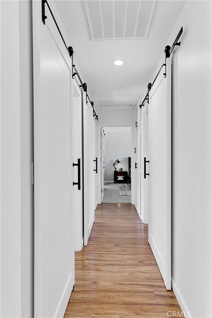 56800 Java Drive Yucca Valley, CA 92284 - Photo 25 of 43 a view of a hallway with wooden floor and staircase