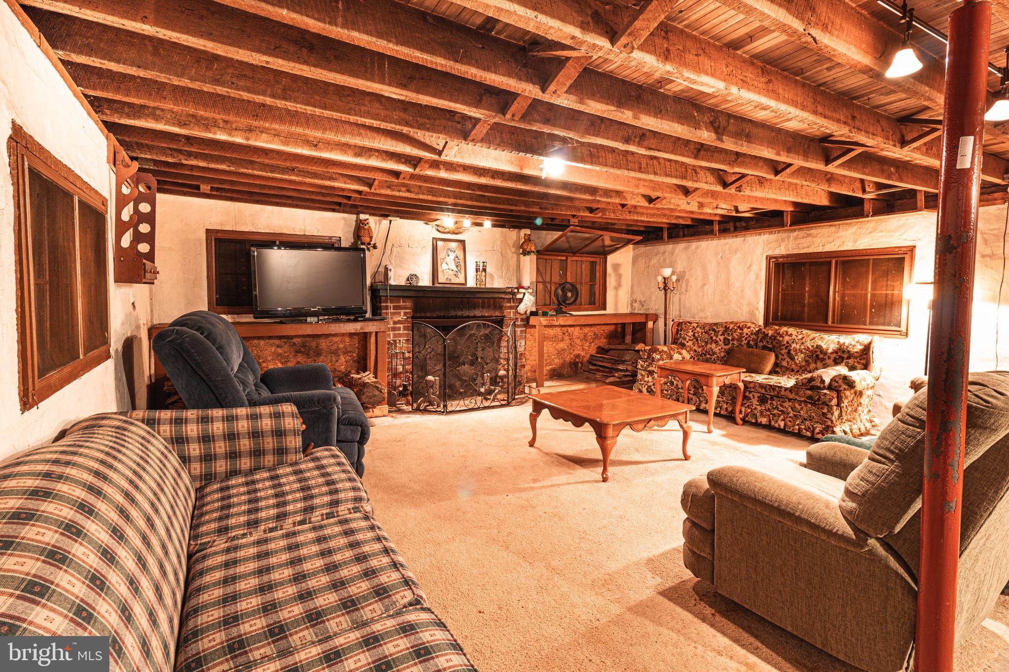 0 Means Hollow Road Shippensburg, PA 17257 - Photo 7 of 52 a living room with furniture and a flat screen tv