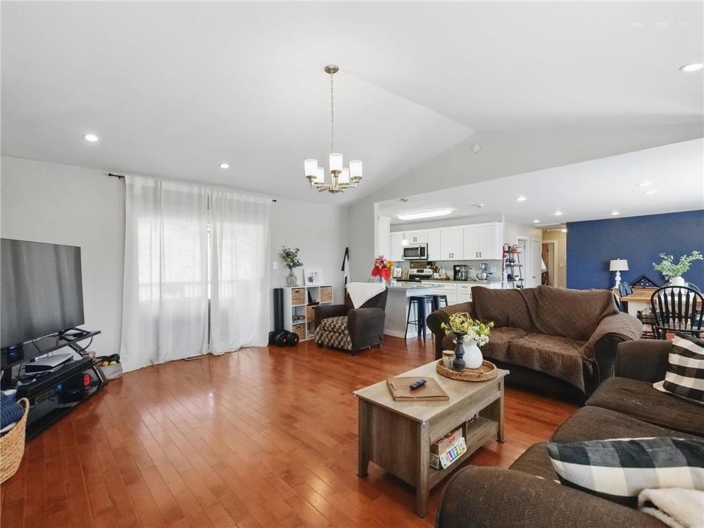 2093 Beverly Road Gainesville, GA 30501 - Photo 17 of 24 a living room with furniture a table and a flat screen tv