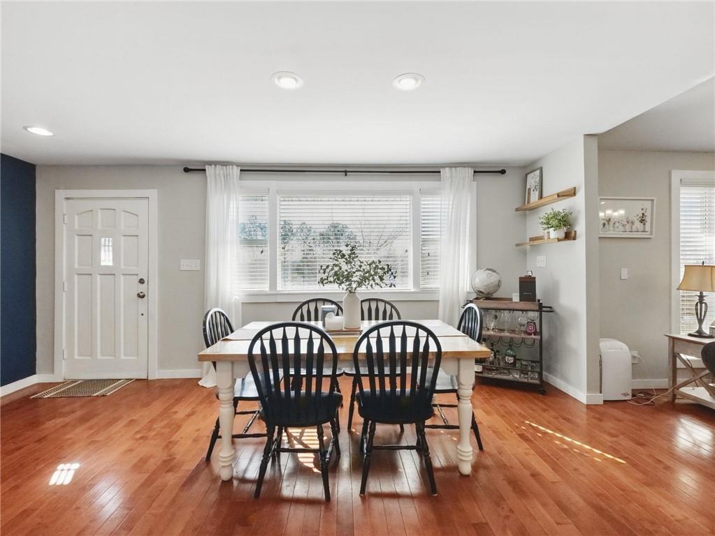 2093 Beverly Road Gainesville, GA 30501 - Photo 19 of 24 a view of a dining room with furniture window and wooden floor