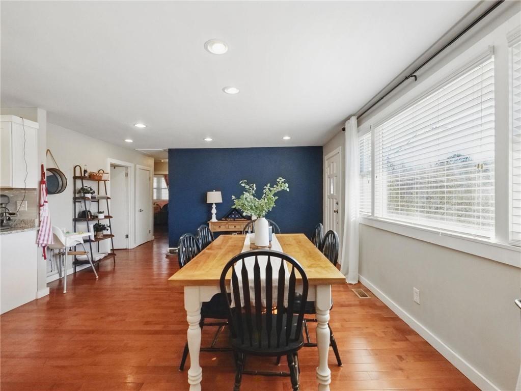 2093 Beverly Road Gainesville, GA 30501 - Photo 22 of 24 a dining room with furniture window and wooden floor