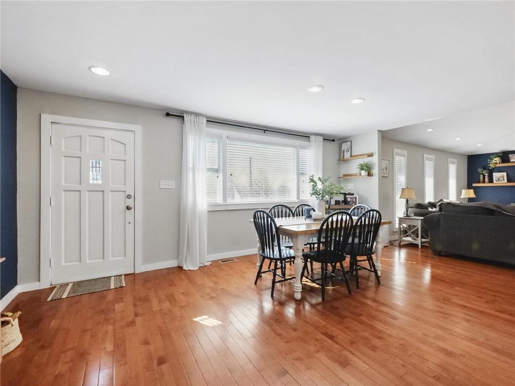 2093 Beverly Road Gainesville, GA 30501 - Photo 23 of 24 a view of a dining room with furniture and wooden floor