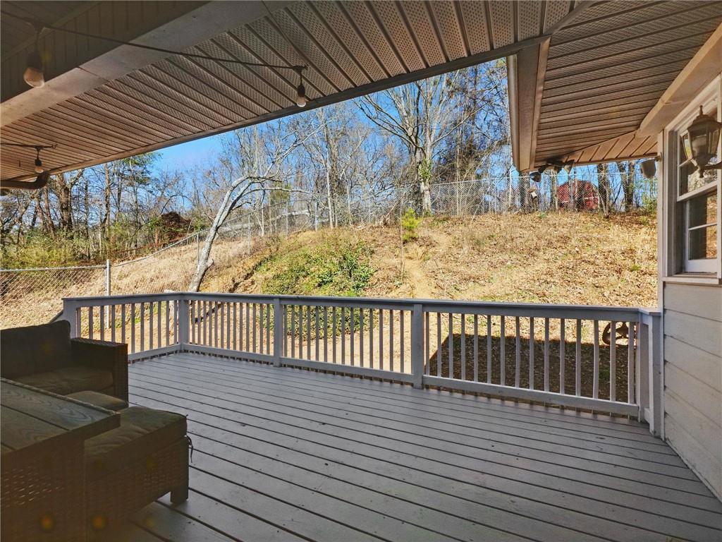 2093 Beverly Road Gainesville, GA 30501 - Photo 3 of 24 a balcony with wooden floor