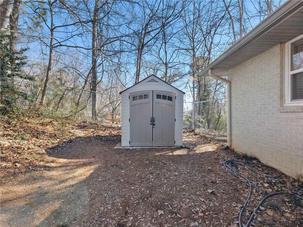 2093 Beverly Road Gainesville, GA 30501 - Photo 4 of 24 a front view of a house with a yard and garage