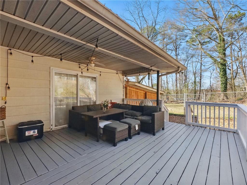 2093 Beverly Road Gainesville, GA 30501 - Photo 5 of 24 a view of a balcony with furniture and wooden floor