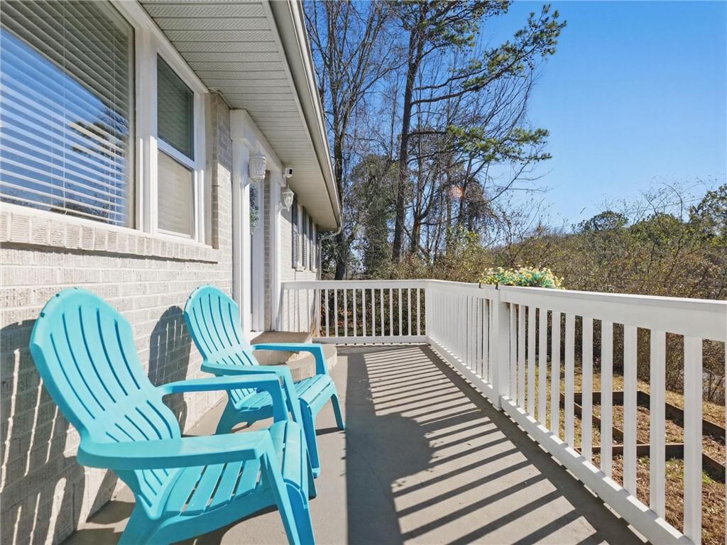 2093 Beverly Road Gainesville, GA 30501 - Photo 8 of 24 a view of balcony with outdoor seating and wooden floor