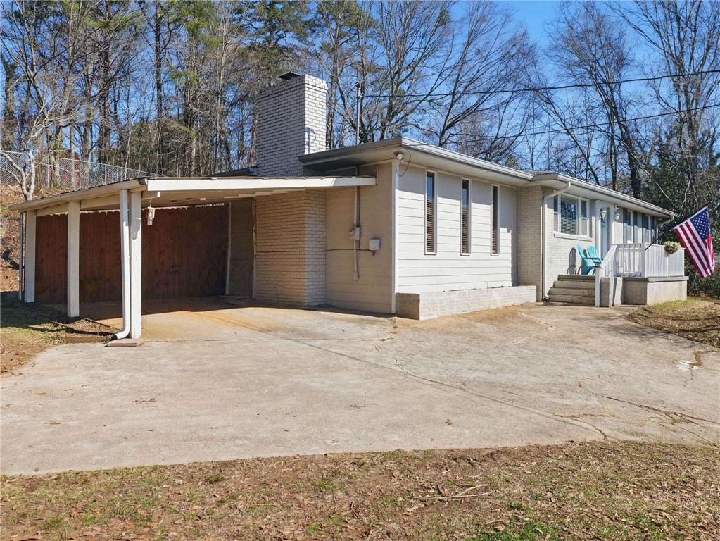 2093 Beverly Road Gainesville, GA 30501 - Photo 9 of 24 a front view of a house with a yard and garage