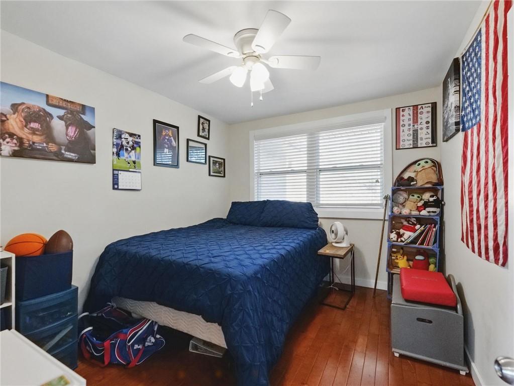 2093 Beverly Road Gainesville, GA 30501 - Photo 10 of 24 a bedroom with a bed and a chandelier