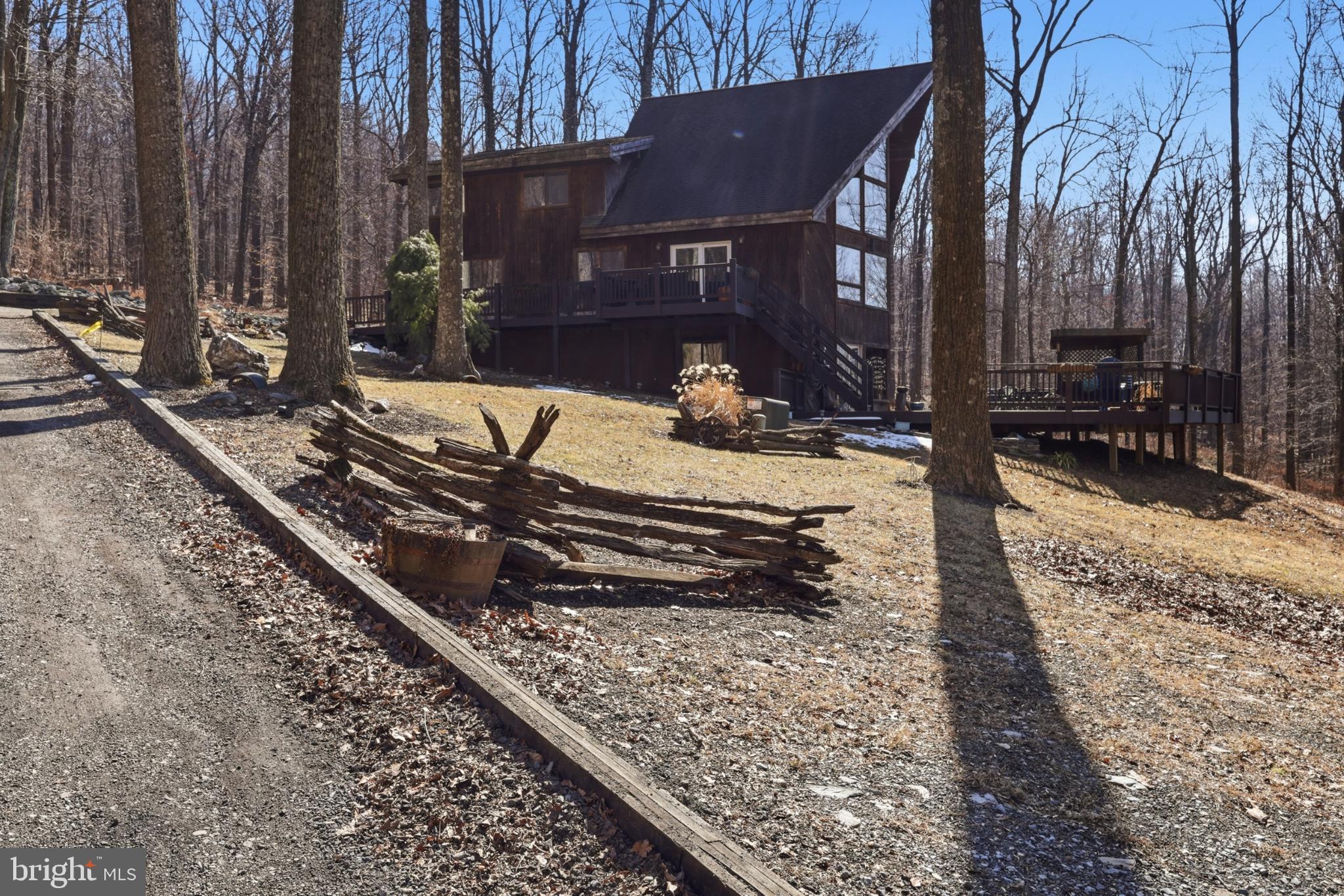 a wooden bench sitting in front of a house
