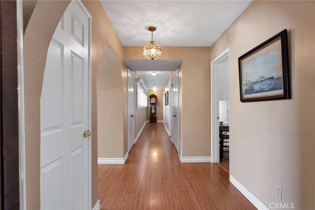 19955 Chickasaw Road Apple Valley, CA 92307 - Photo 21 of 60 a view of a hallway with wooden floor