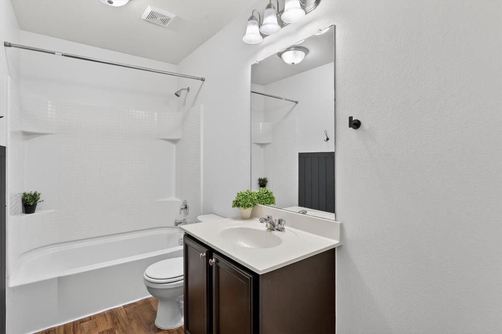 1627 Kawati Way Krum, TX 76249 - Photo 26 of 32 a bathroom with a sink toilet and shower