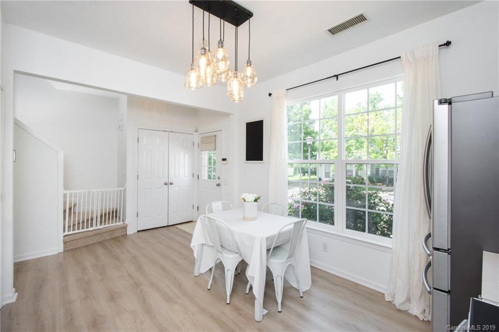 6864 Rothchild Drive Charlotte, NC 28270 - Photo 8 of 36 a view of a dining room with furniture window and wooden floor