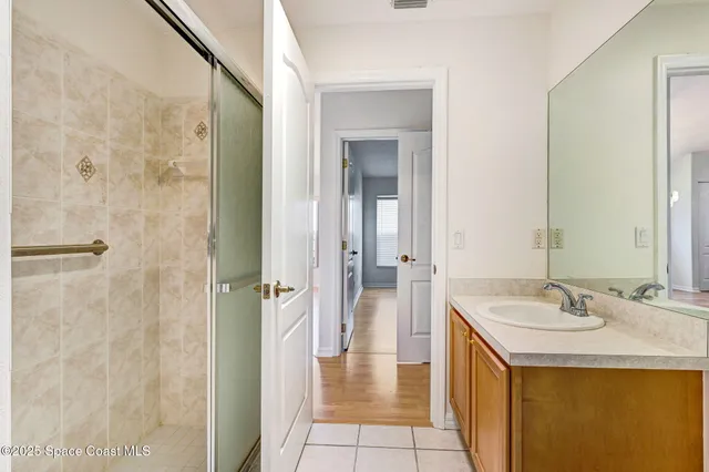 a view of washer and dryer with kitchen in the background
