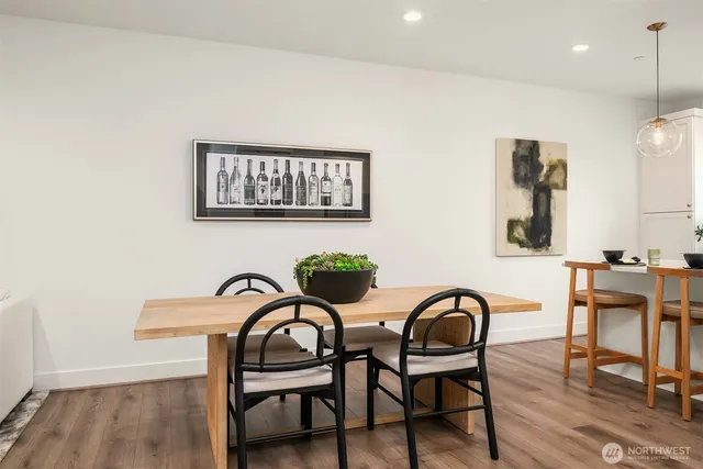 a kitchen with a dining table and chairs