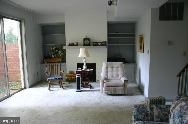 11449 Waterview Cluster Reston, VA 20190 - Photo 3 of 8 a living room with furniture and a window