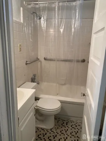 a bathroom with a toilet a sink and a bathtub