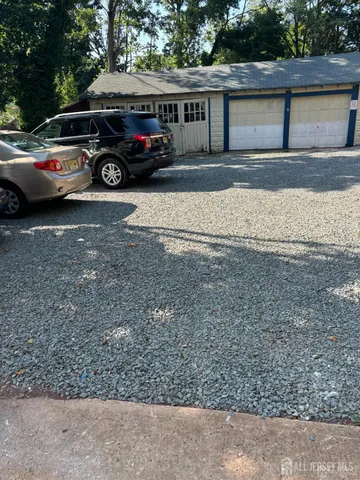 a view of a car parked in front of a house