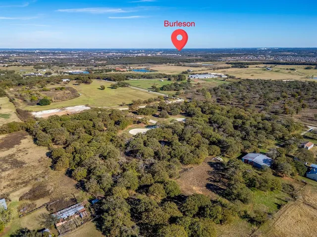 an aerial view of residential building and ocean view
