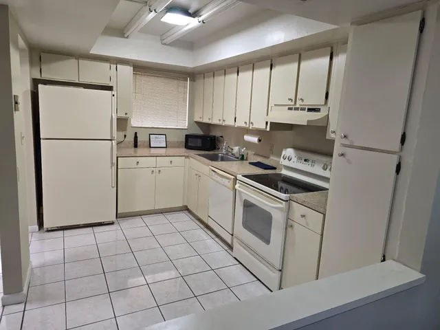 a view of a room with a wooden floor and a window