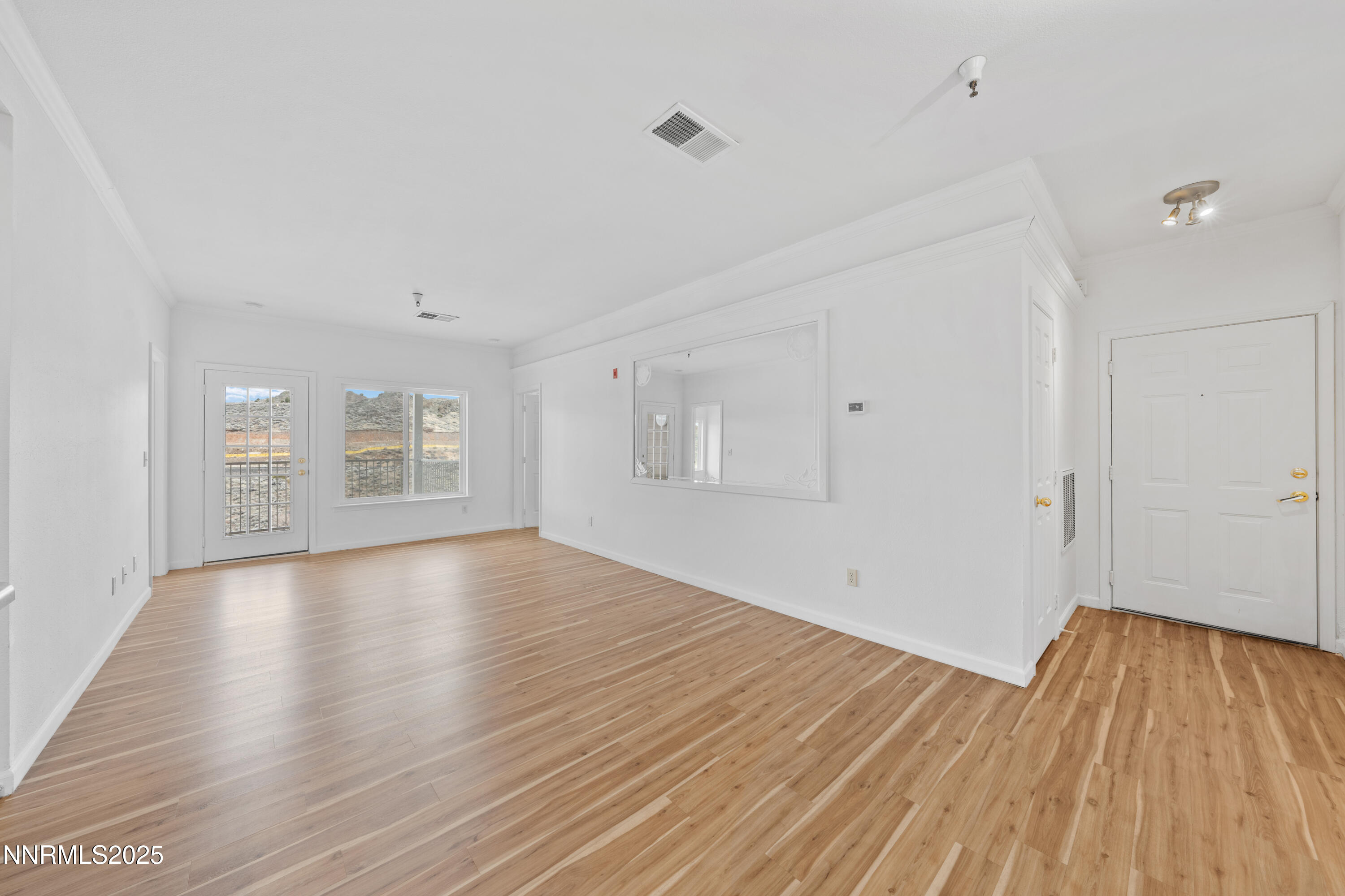 200 Talus Way, Unit 522 Reno, NV 89503 - Photo 13 of 40 a view of empty room with wooden floor and fan