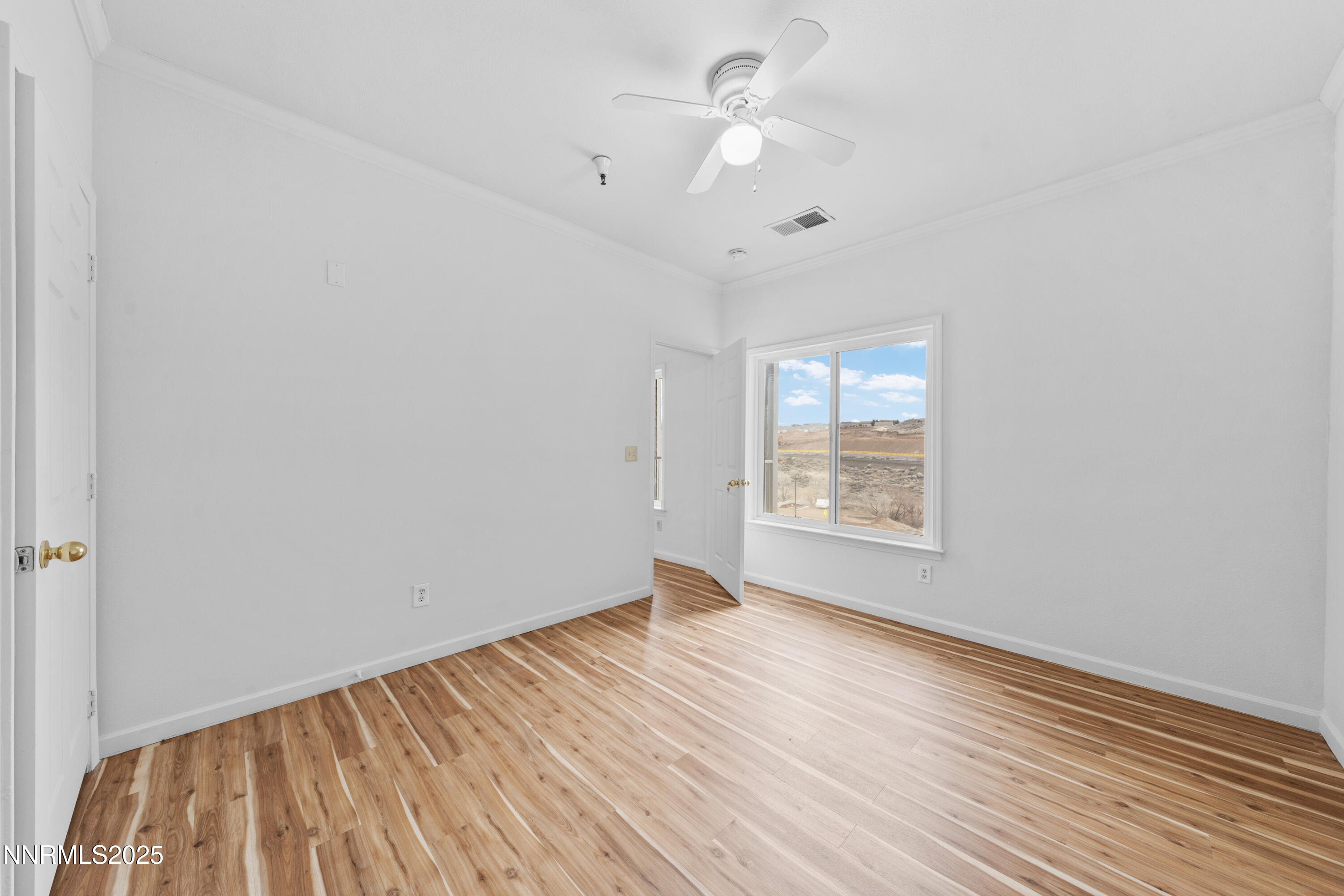 200 Talus Way, Unit 522 Reno, NV 89503 - Photo 16 of 40 an empty room with wooden floor fan and windows