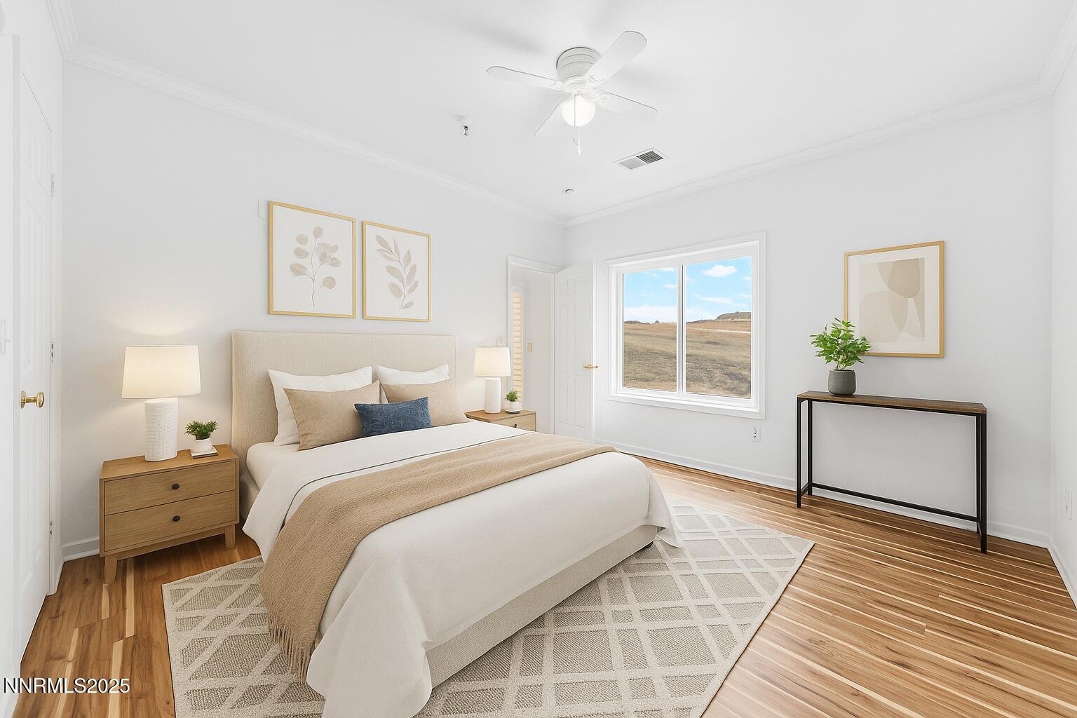 200 Talus Way, Unit 522 Reno, NV 89503 - Photo 20 of 40 a bedroom with a large bed and a chandelier