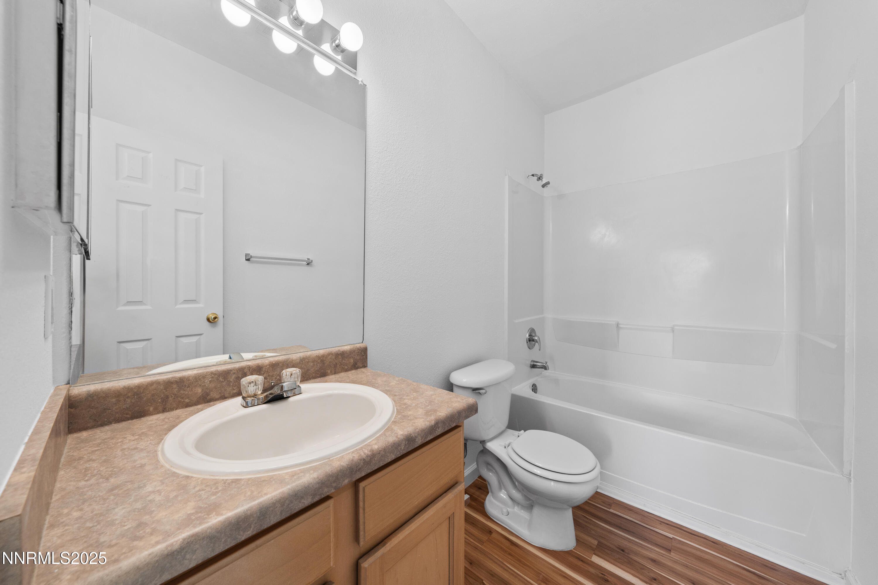 200 Talus Way, Unit 522 Reno, NV 89503 - Photo 23 of 40 a bathroom with a sink toilet a mirror and shower