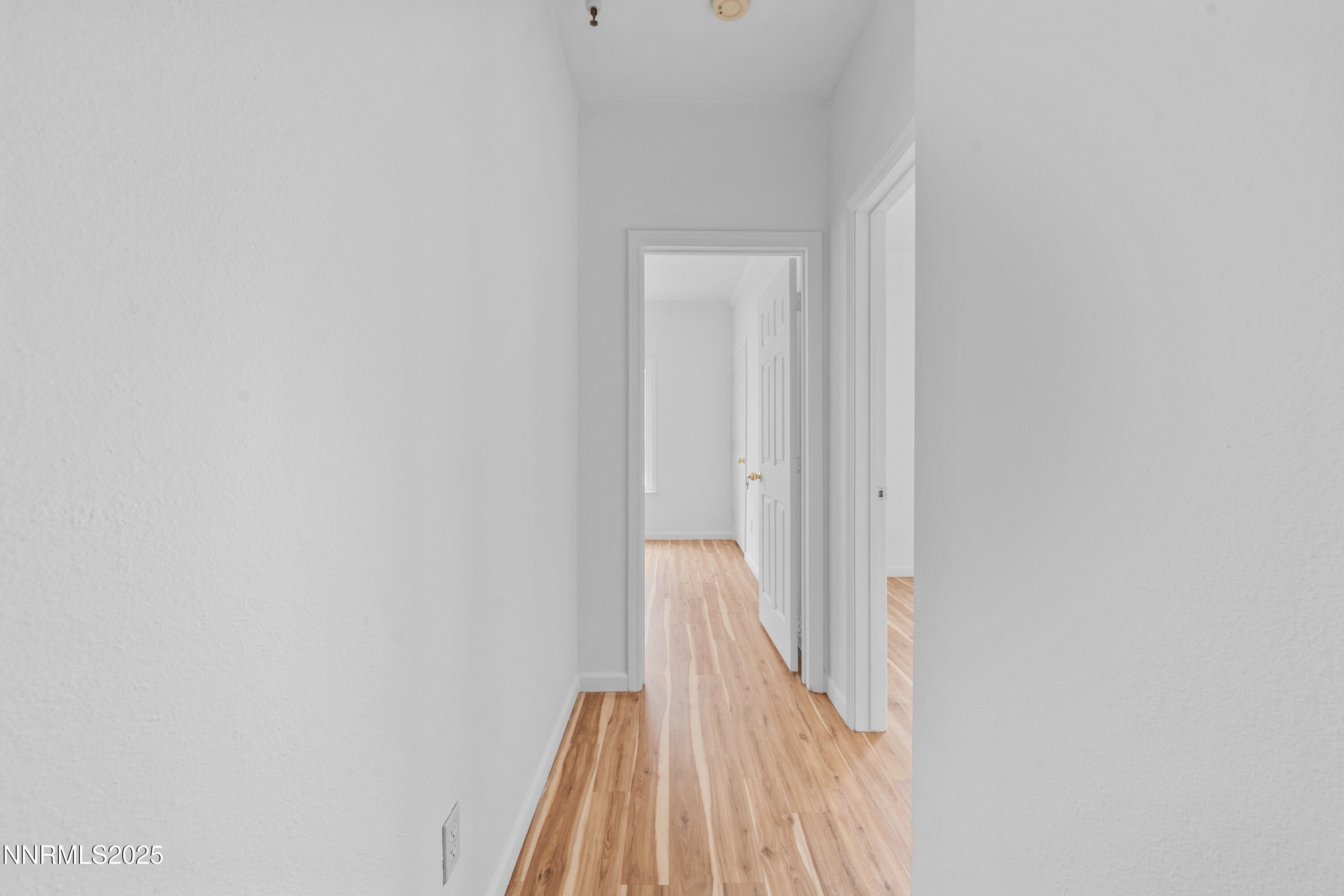 200 Talus Way, Unit 522 Reno, NV 89503 - Photo 25 of 40 a view of a hallway with wooden floor