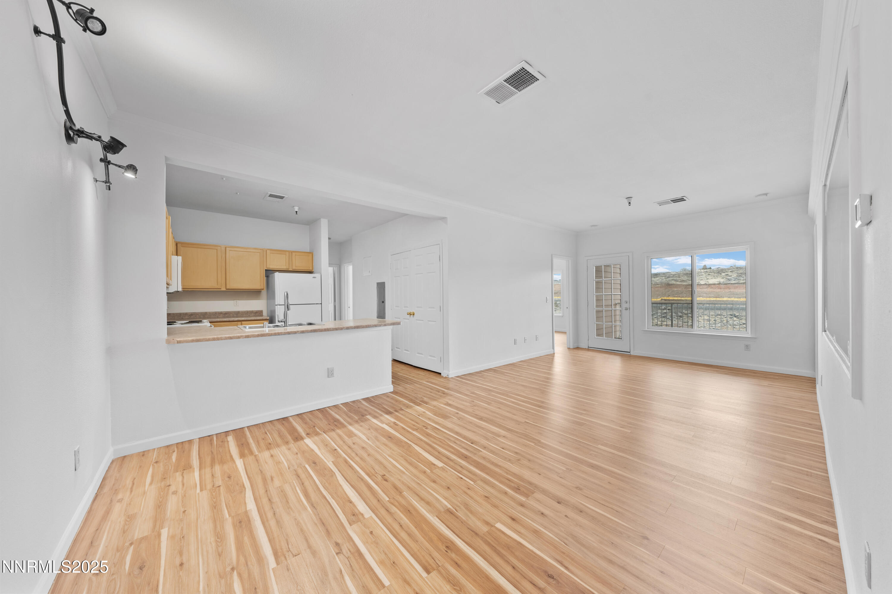 200 Talus Way, Unit 522 Reno, NV 89503 - Photo 6 of 40 a view of a kitchen with wooden floor and a sink