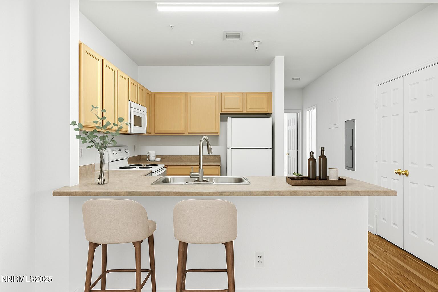 200 Talus Way, Unit 522 Reno, NV 89503 - Photo 7 of 40 a kitchen with stainless steel appliances granite countertop a sink and white cabinets