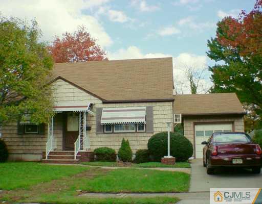 172 East Hill Road Colonia, NJ 07067 - Photo 1 of 2 a front view of a house with a garden and plants