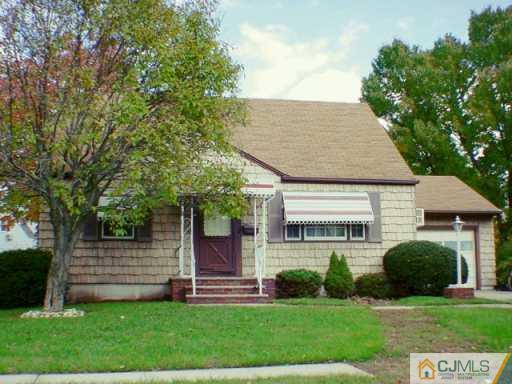 172 East Hill Road Colonia, NJ 07067 - Photo 2 of 2 front view of a house with a yard