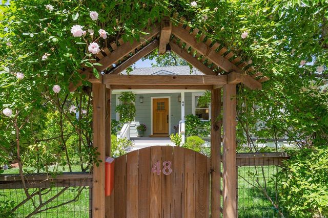 a house view with a garden space