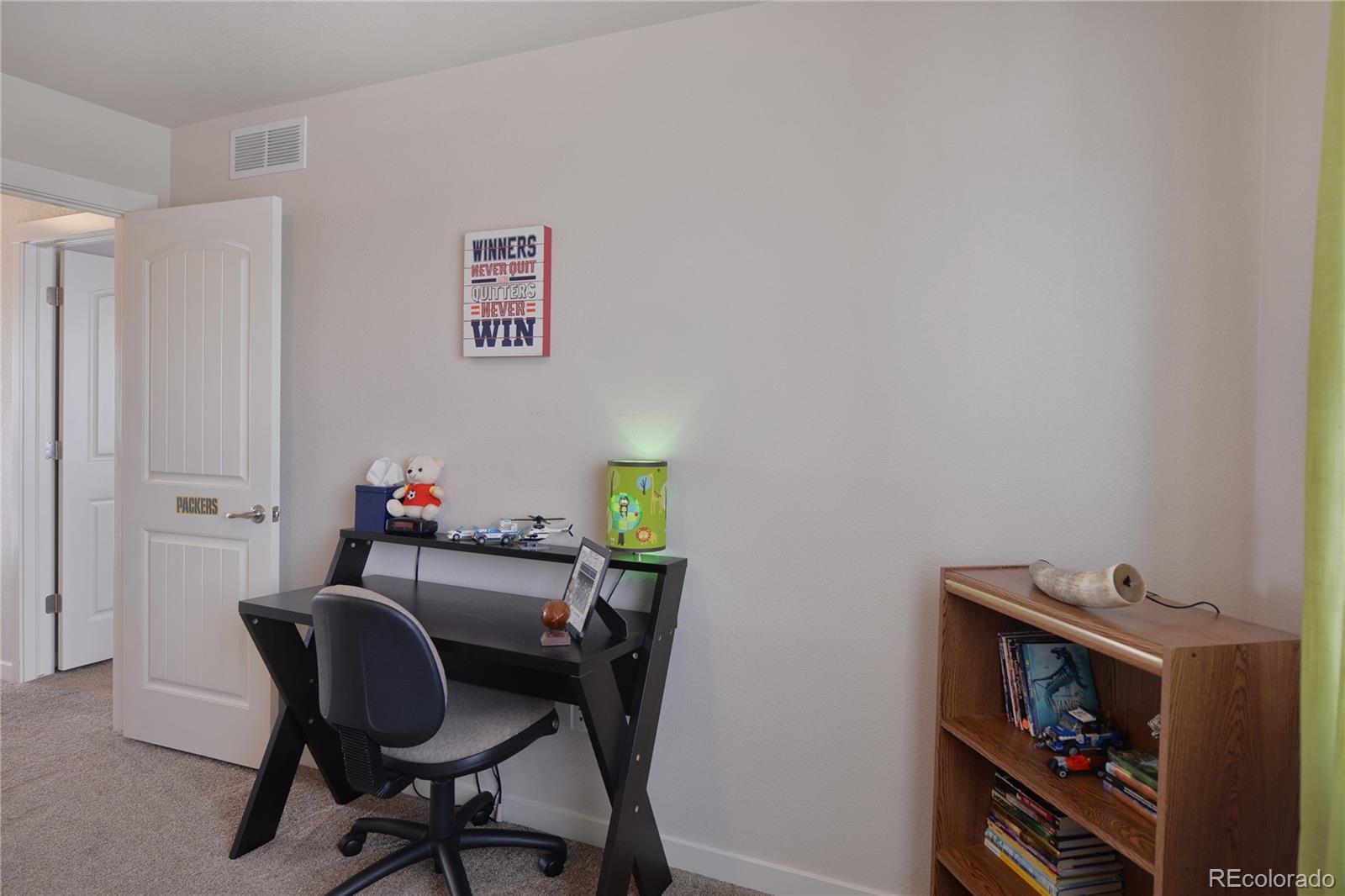 1643 Alpine Avenue Berthoud, CO 80513 - Photo 20 of 40 a view of a workspace with furniture and wooden floor