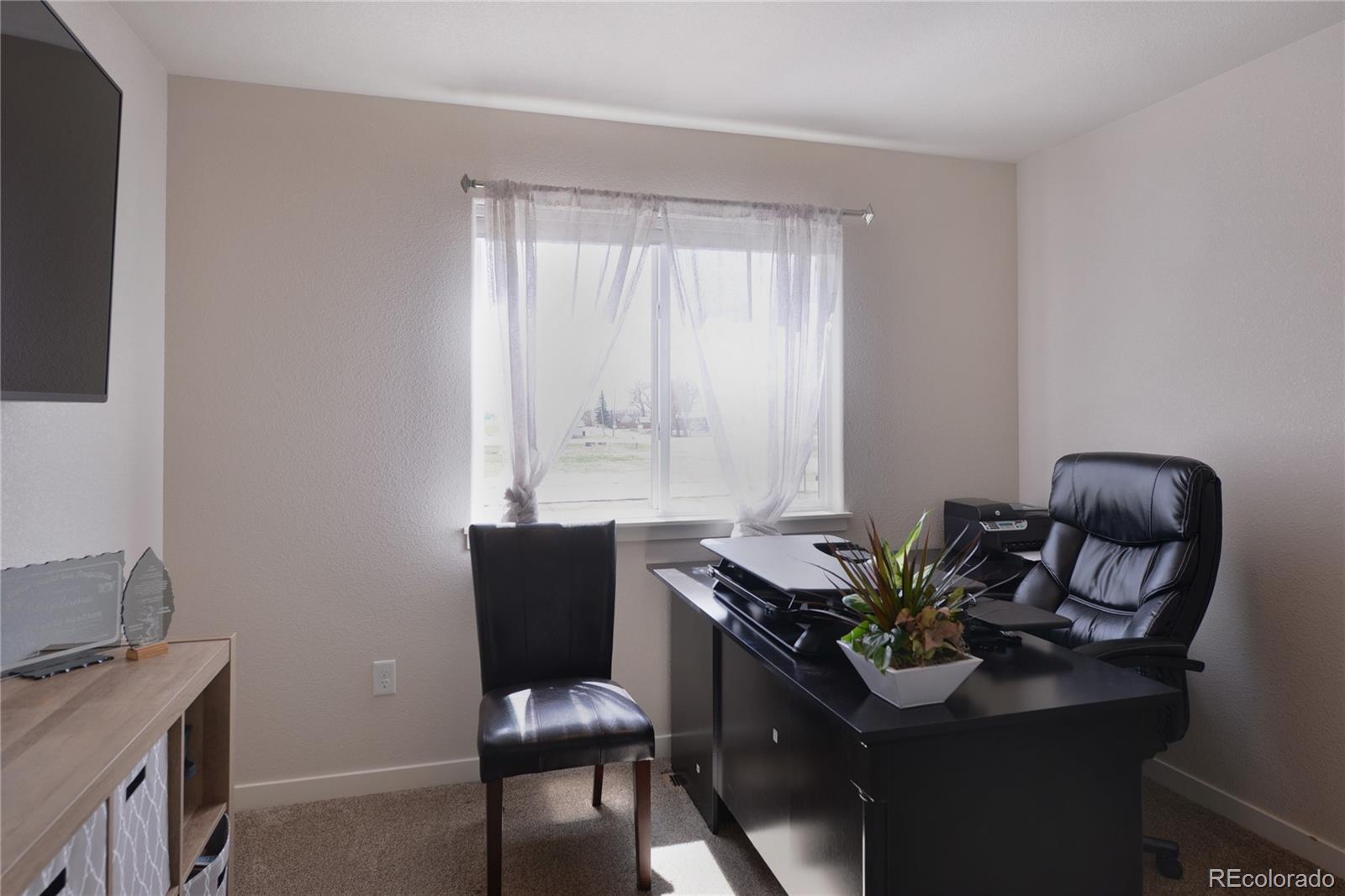 1643 Alpine Avenue Berthoud, CO 80513 - Photo 21 of 40 a view of a workspace with furniture and a window