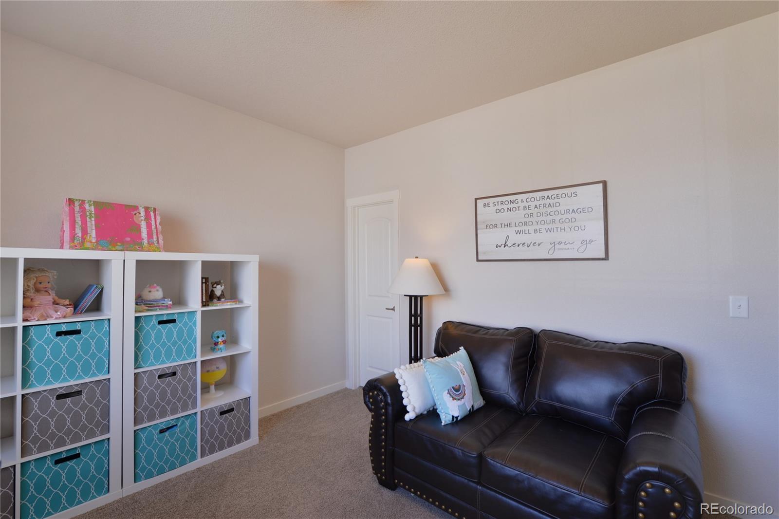 1643 Alpine Avenue Berthoud, CO 80513 - Photo 27 of 40 a living room with furniture