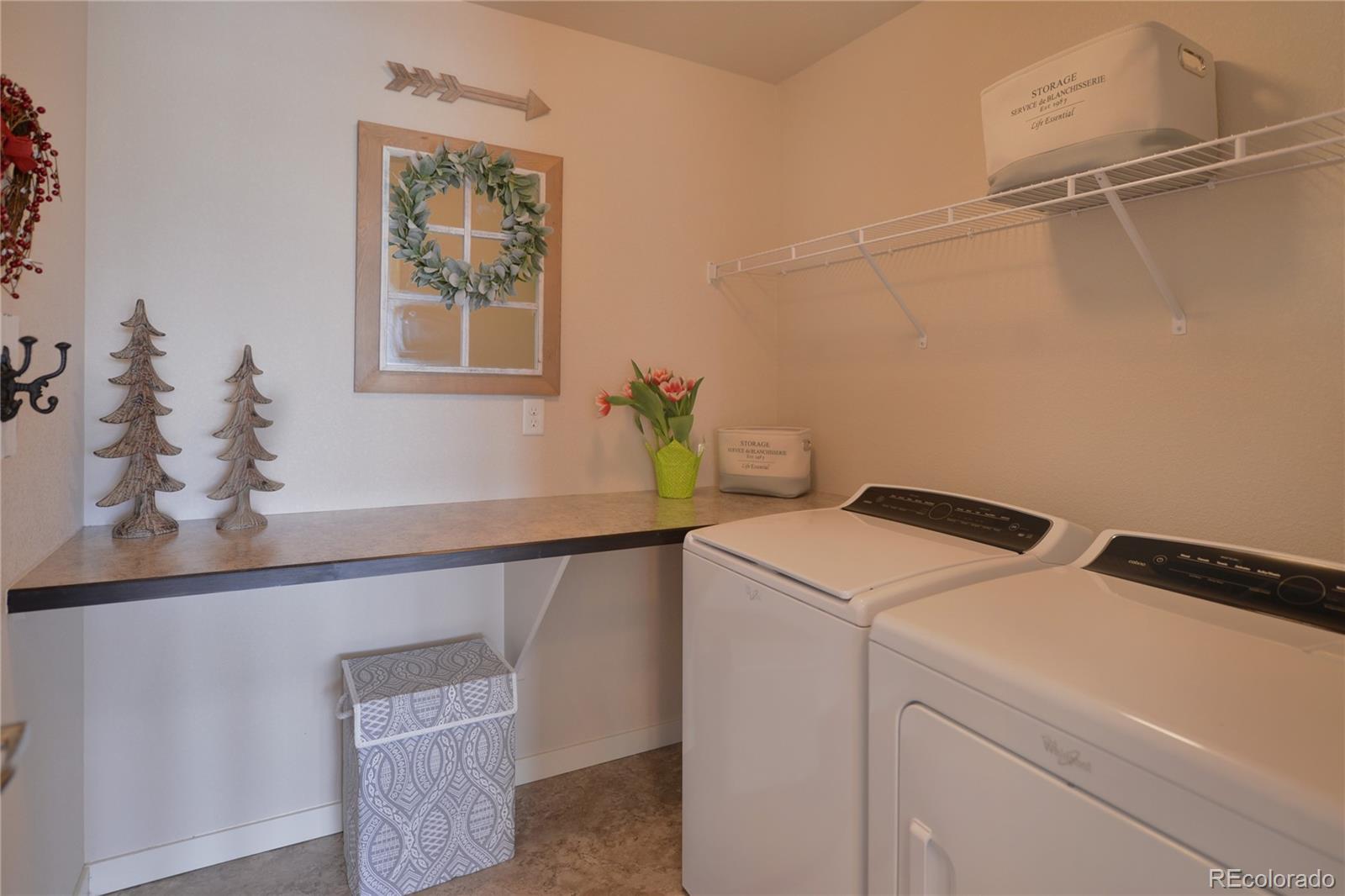 1643 Alpine Avenue Berthoud, CO 80513 - Photo 29 of 40 a utility room with dryer and washer