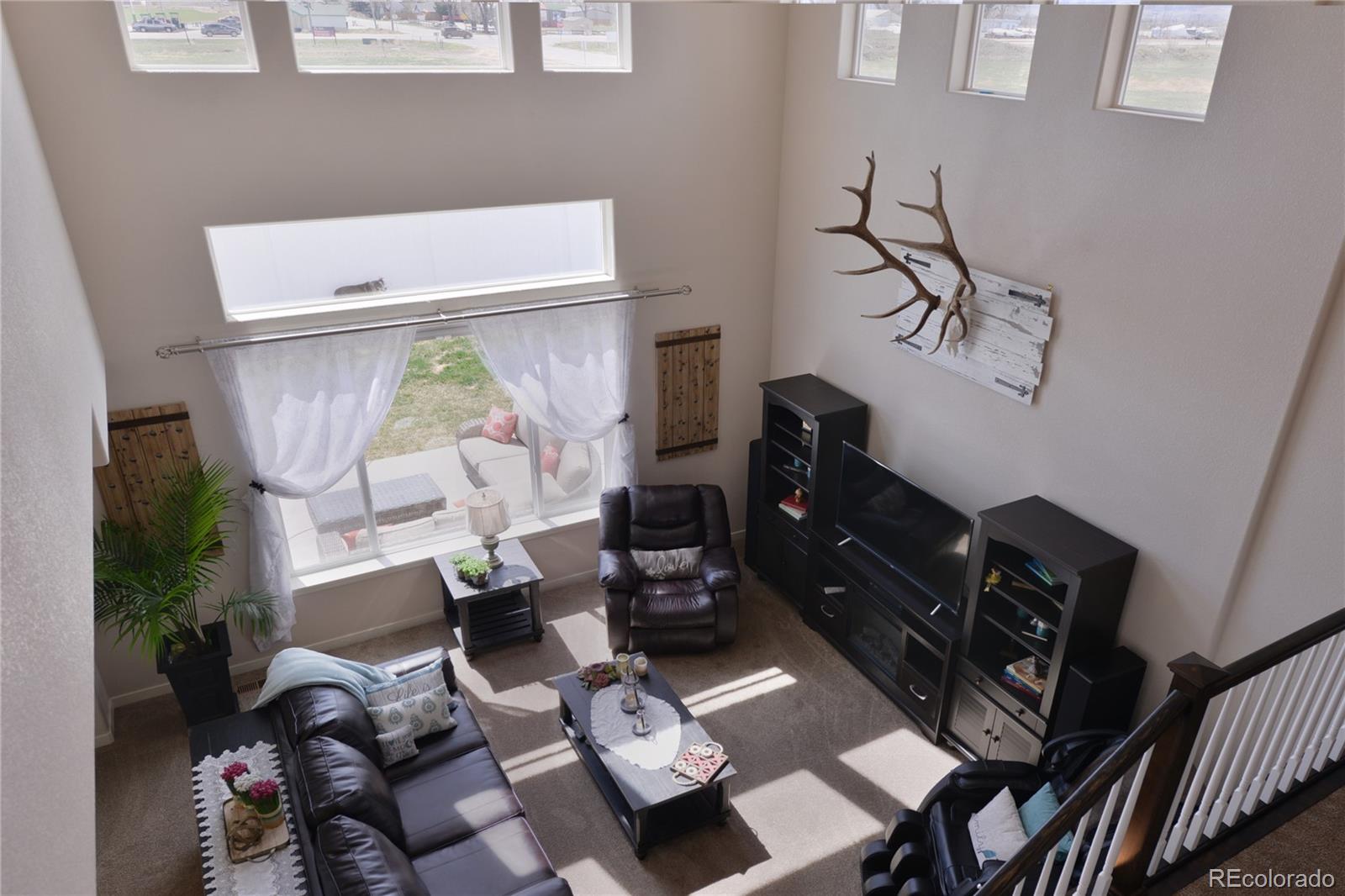 1643 Alpine Avenue Berthoud, CO 80513 - Photo 6 of 40 a living room with furniture and wooden floor