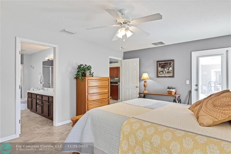 132 Drake Way Sebastian, FL 32958 - Photo 17 of 37 a bedroom with a bed and dresser