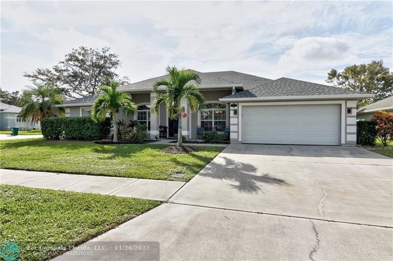 132 Drake Way Sebastian, FL 32958 - Photo 2 of 37 front view of a house with a yard